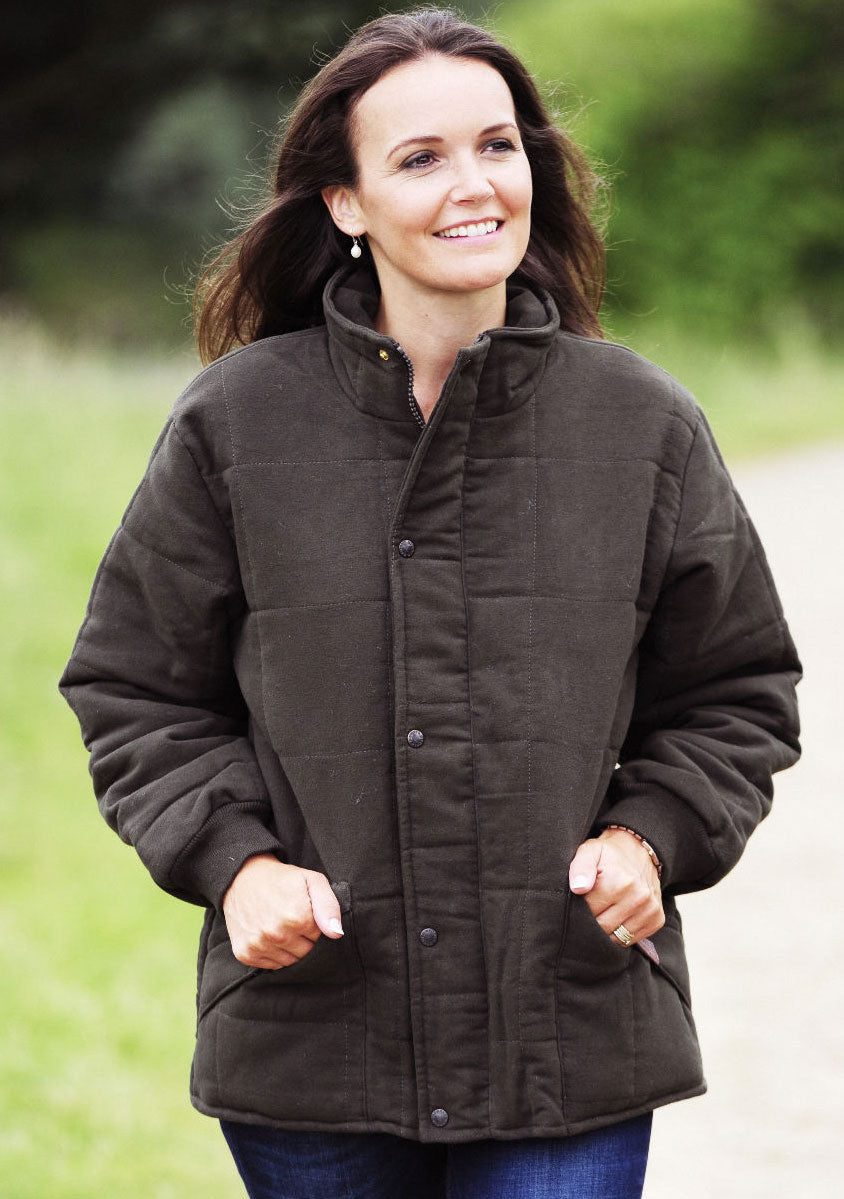 lady in Bronte Quilted Moleskin Jacket. Green
