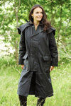 woman wearing Long Waxed Cotton Coat by Bronte Outdoor. #colour_green