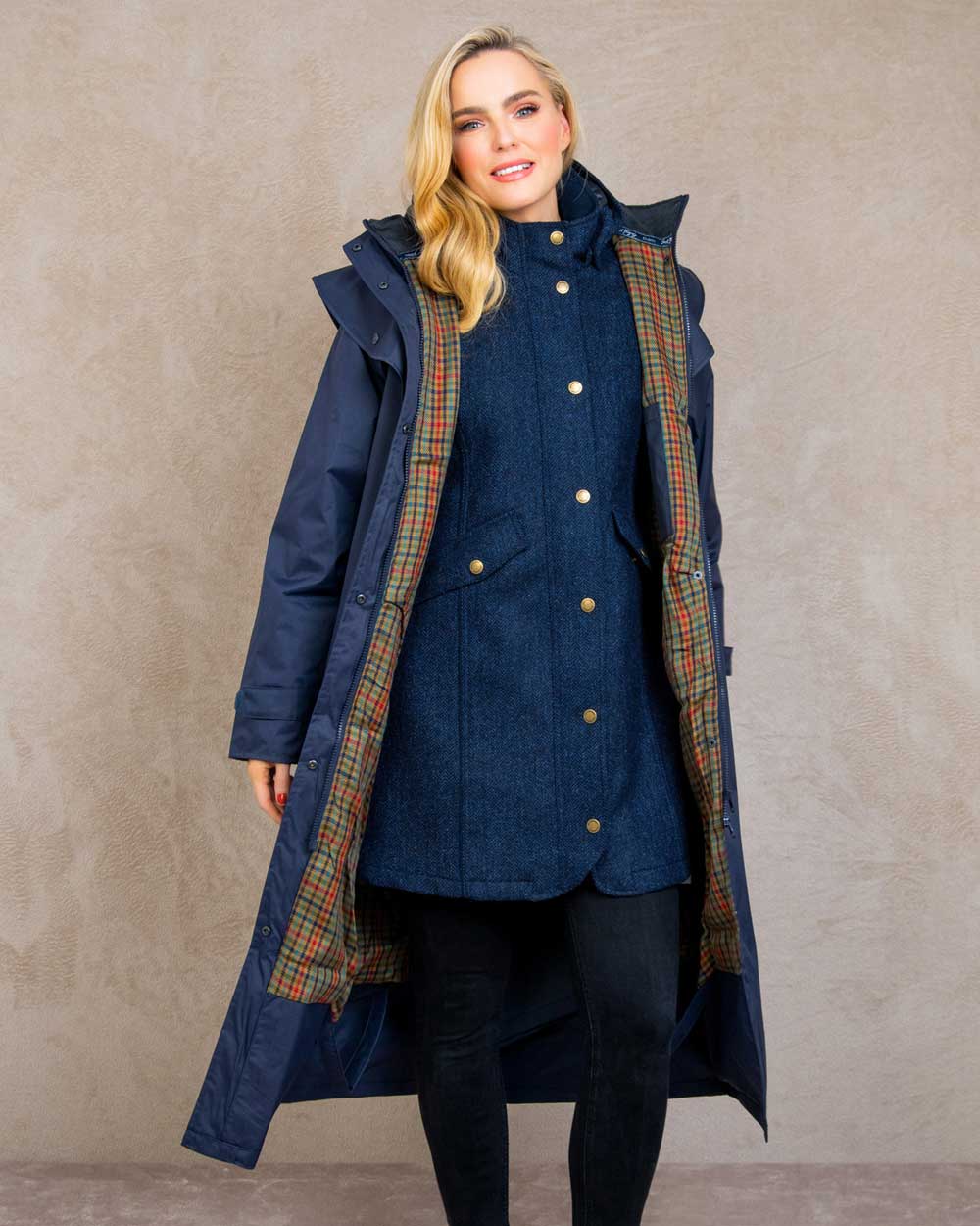 Heritage Navy coloured Jack Murphy Malvern Ladies Waterproof Bush Coat on wall background 