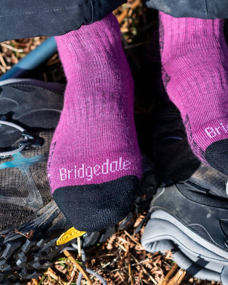 Person wearing Bridgedale hiking socks with trail shoes outdoors