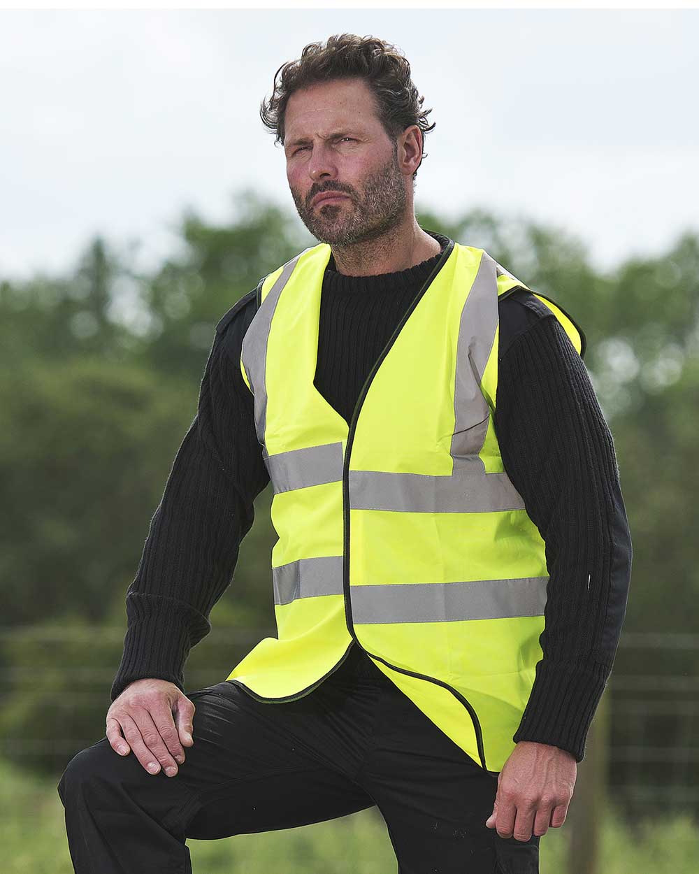 Man wearing Yellow Fort Hi-Vis Vest with reflective strips 