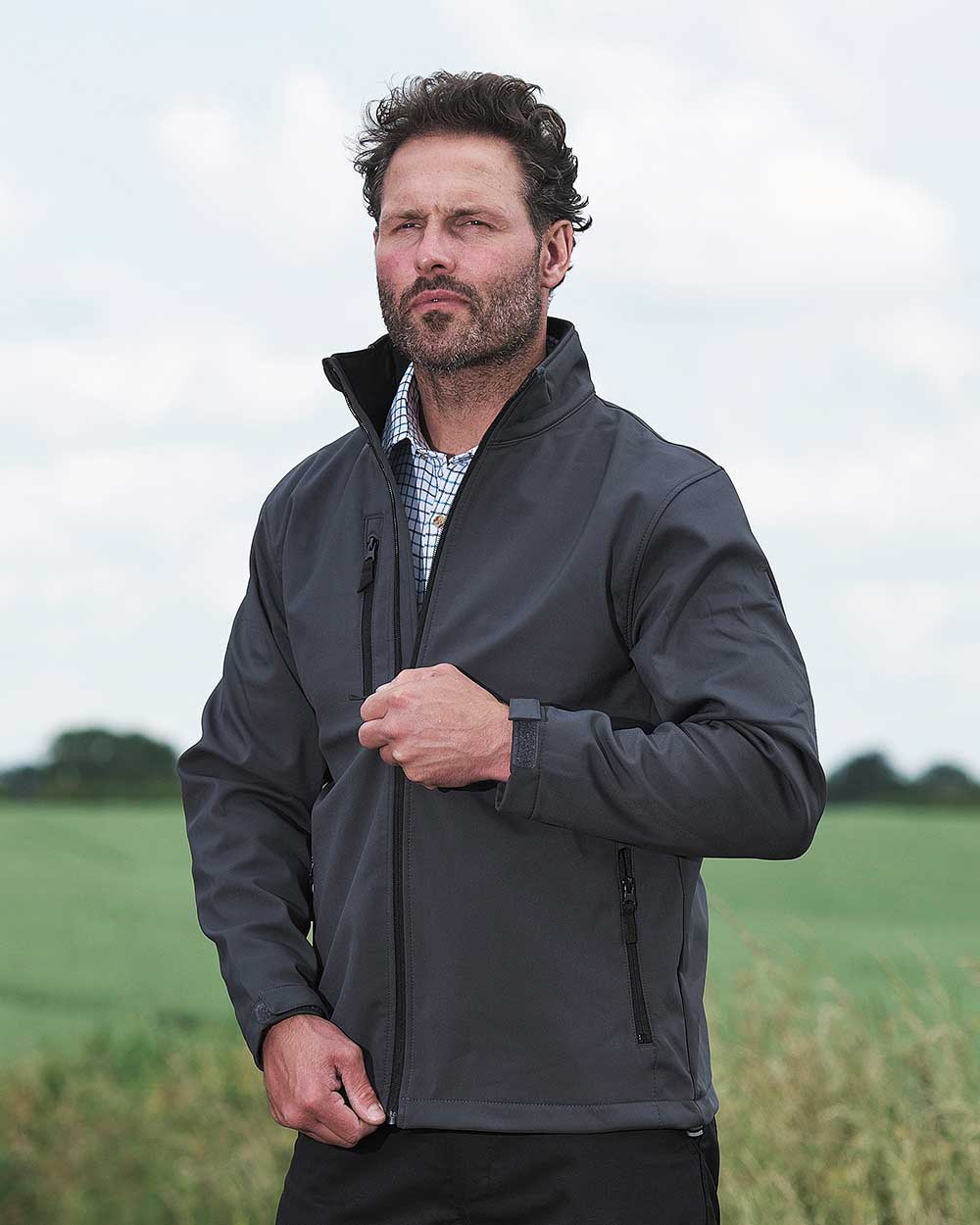 Farmer wearing Fort Selkirk Softshell Waterproof Jacket in Grey 