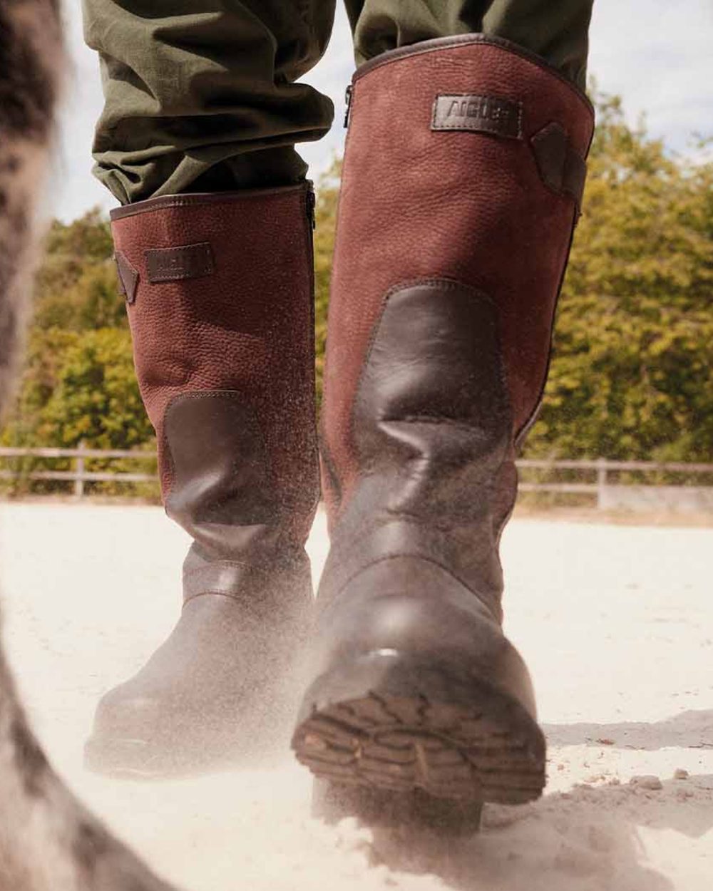 Dark Brown coloured Aigle Mens Inverss Gore-Tex Leather Boots on sand background 