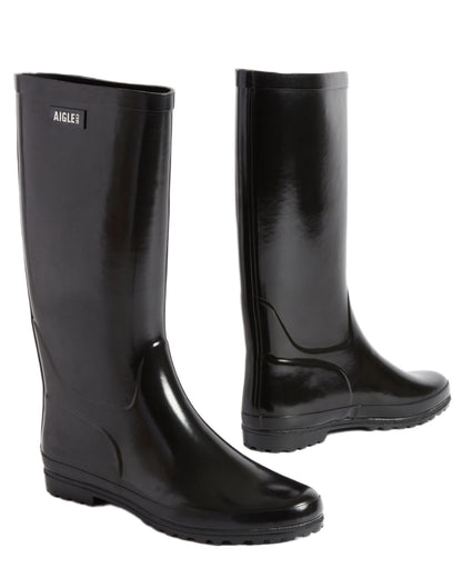 Noir coloured Aigle Womens Eliosa Wellingtons on white background 