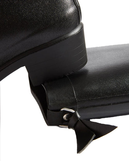 Noir coloured Aigle Womens Myrica Wellingtons on white background 