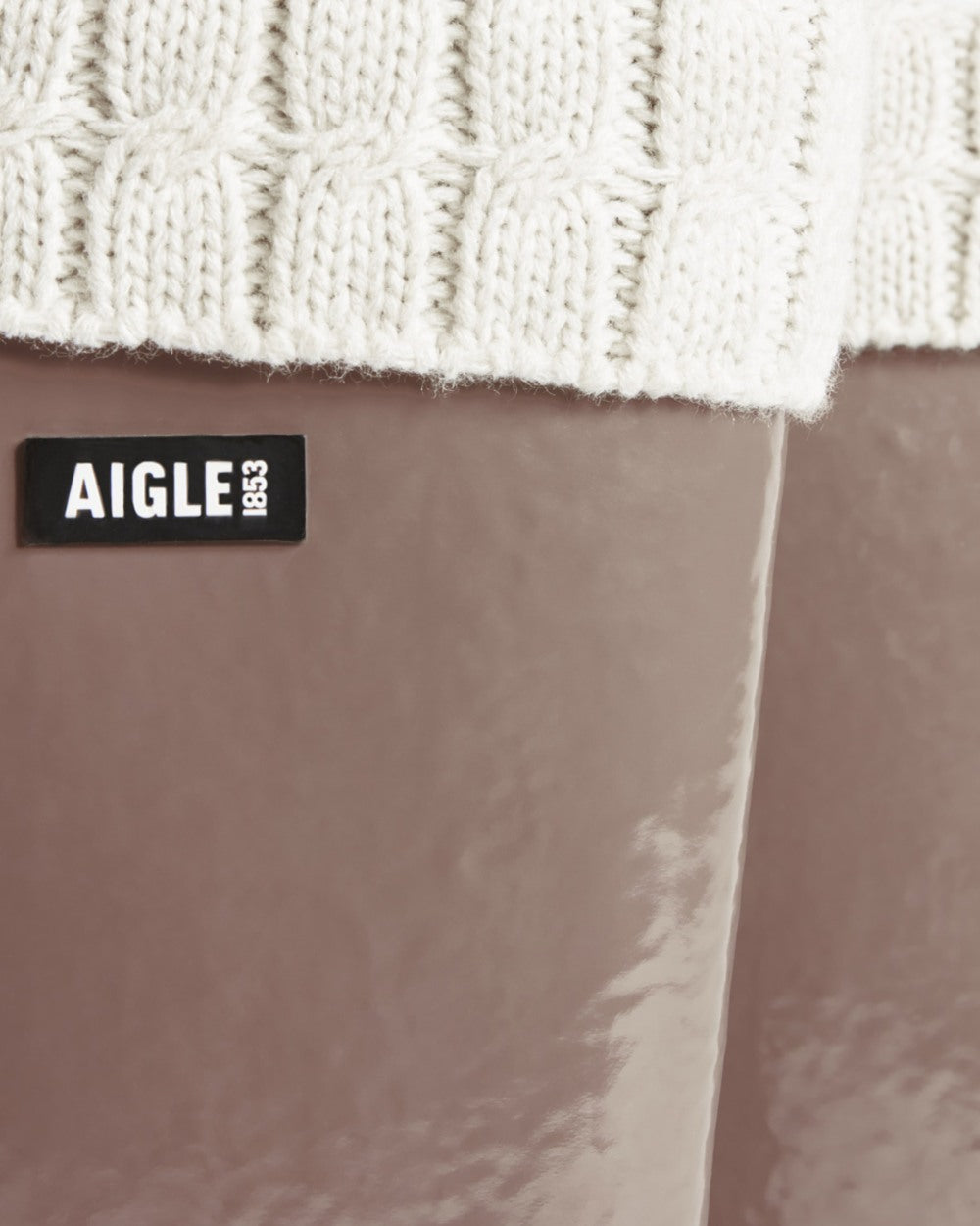 Chestnut coloured Aigle Womens Eliosa Fur Lined Wellingtons on white background 