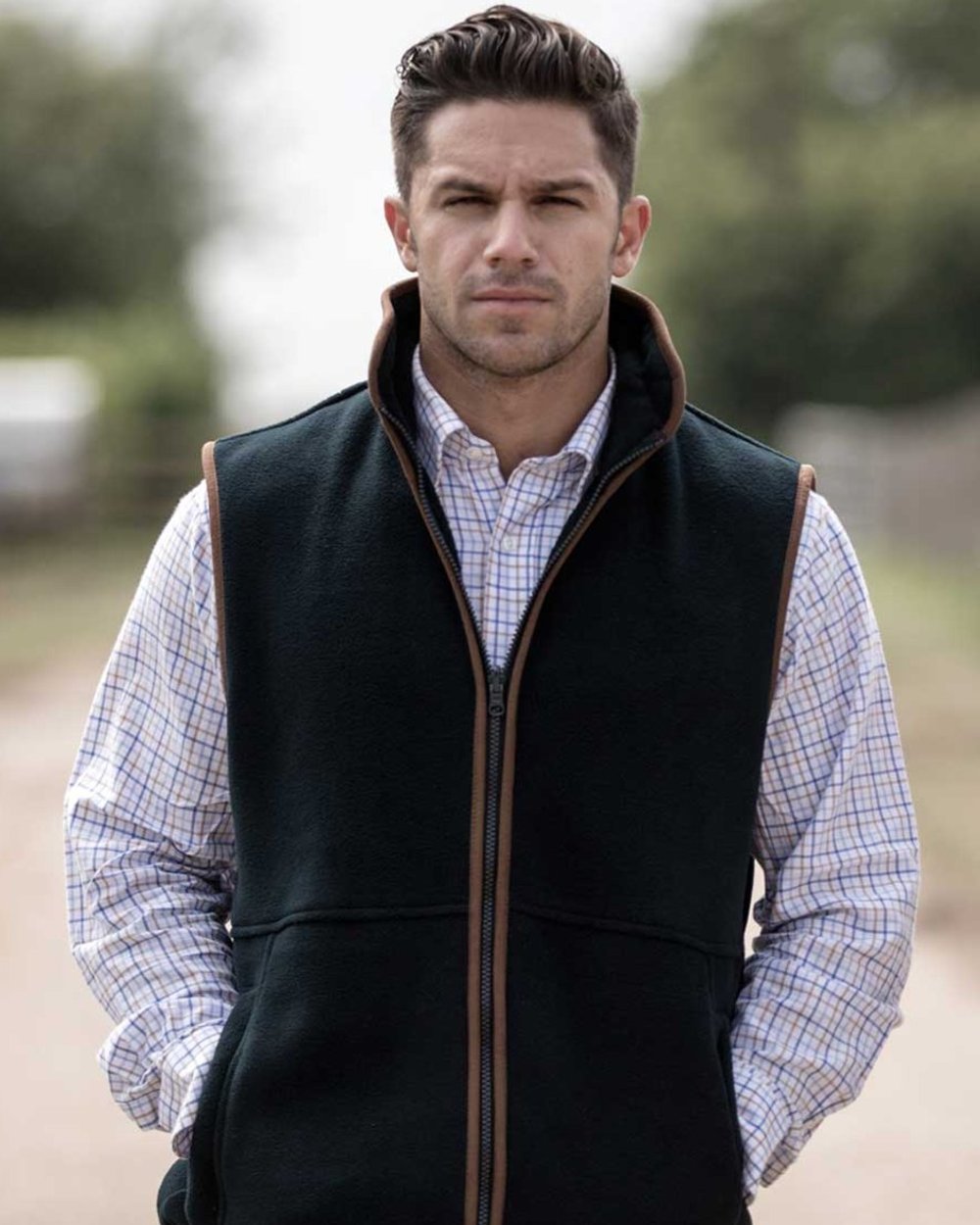 Dark Navy coloured Alan Paine Aylsham Fleece Jacket on blurry background 