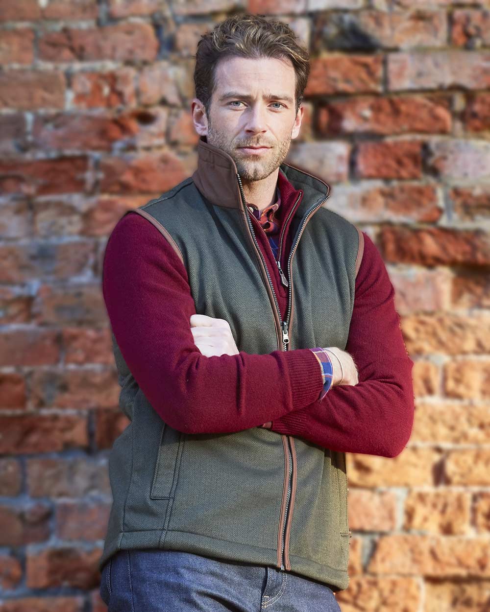 Green Herringbone coloured Alan Paine Aylsham Fleece Jacket on brick wall background 