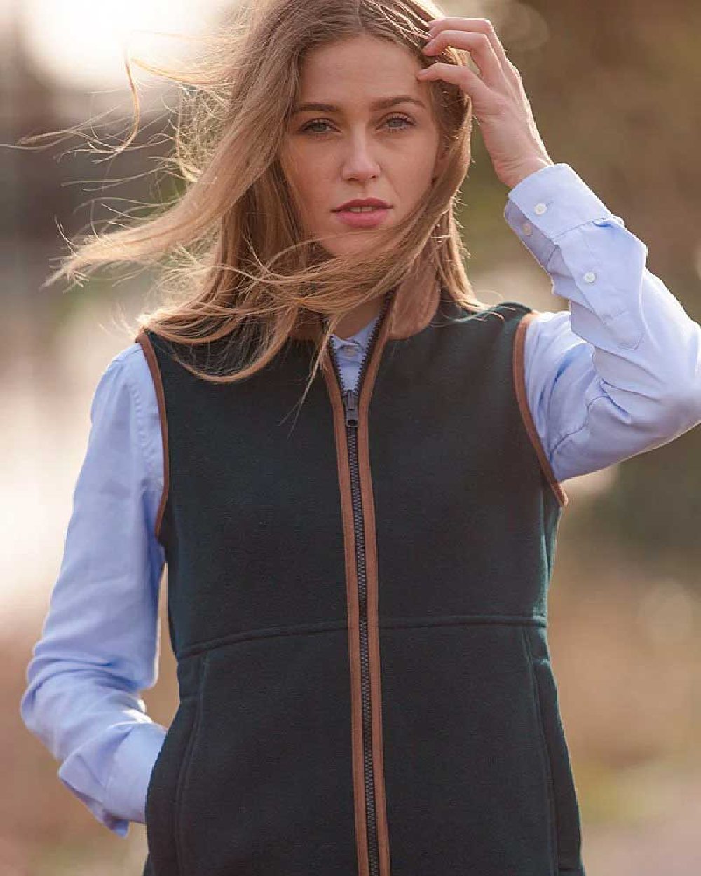 Dark Navy Coloured Alan Paine Aylsham Ladies Fleece Gilet on blurry background 