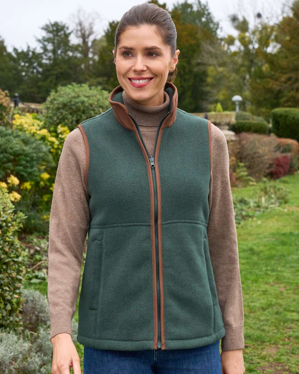 Evergreen Coloured Alan Paine Aylsham Ladies Fleece Gilet on outdoor background 