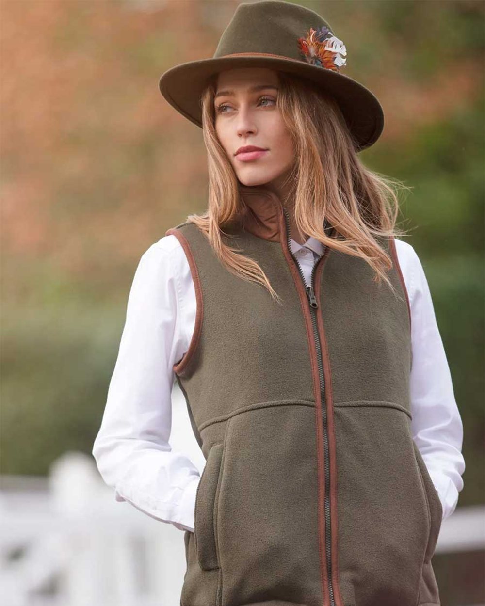 Green Coloured Alan Paine Aylsham Ladies Fleece Gilet on blurry background 