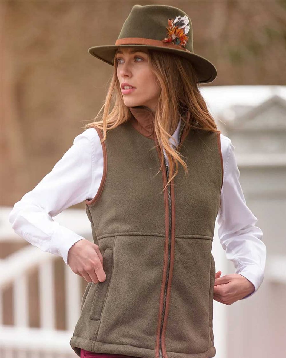Green Coloured Alan Paine Aylsham Ladies Fleece Gilet on blurry background 