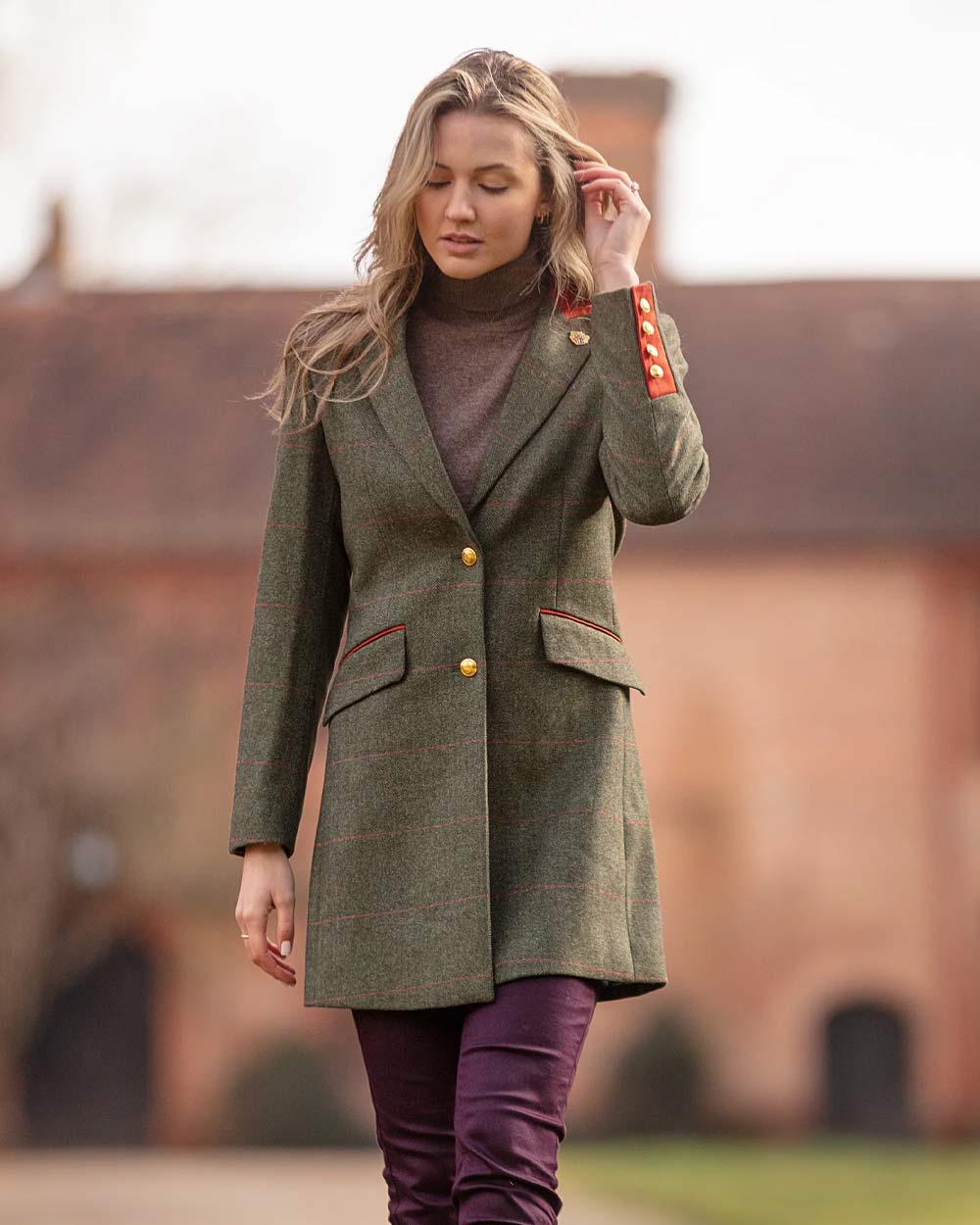 Heath coloured Alan Paine Combrook Ladies Mid Thigh Coat on blurry background 