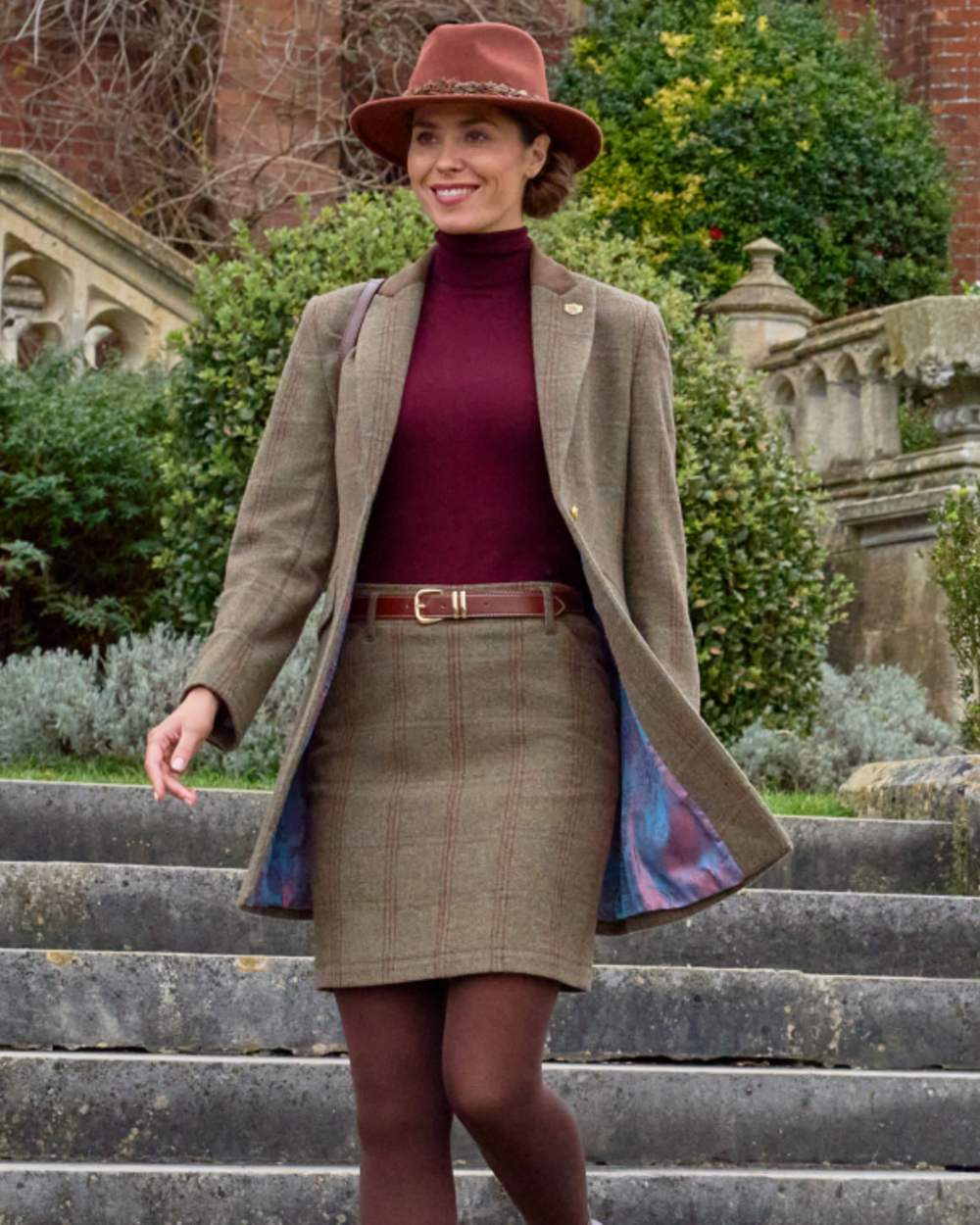 Laurel coloured Alan Paine Combrook Ladies Mid Thigh Coat on palace background 