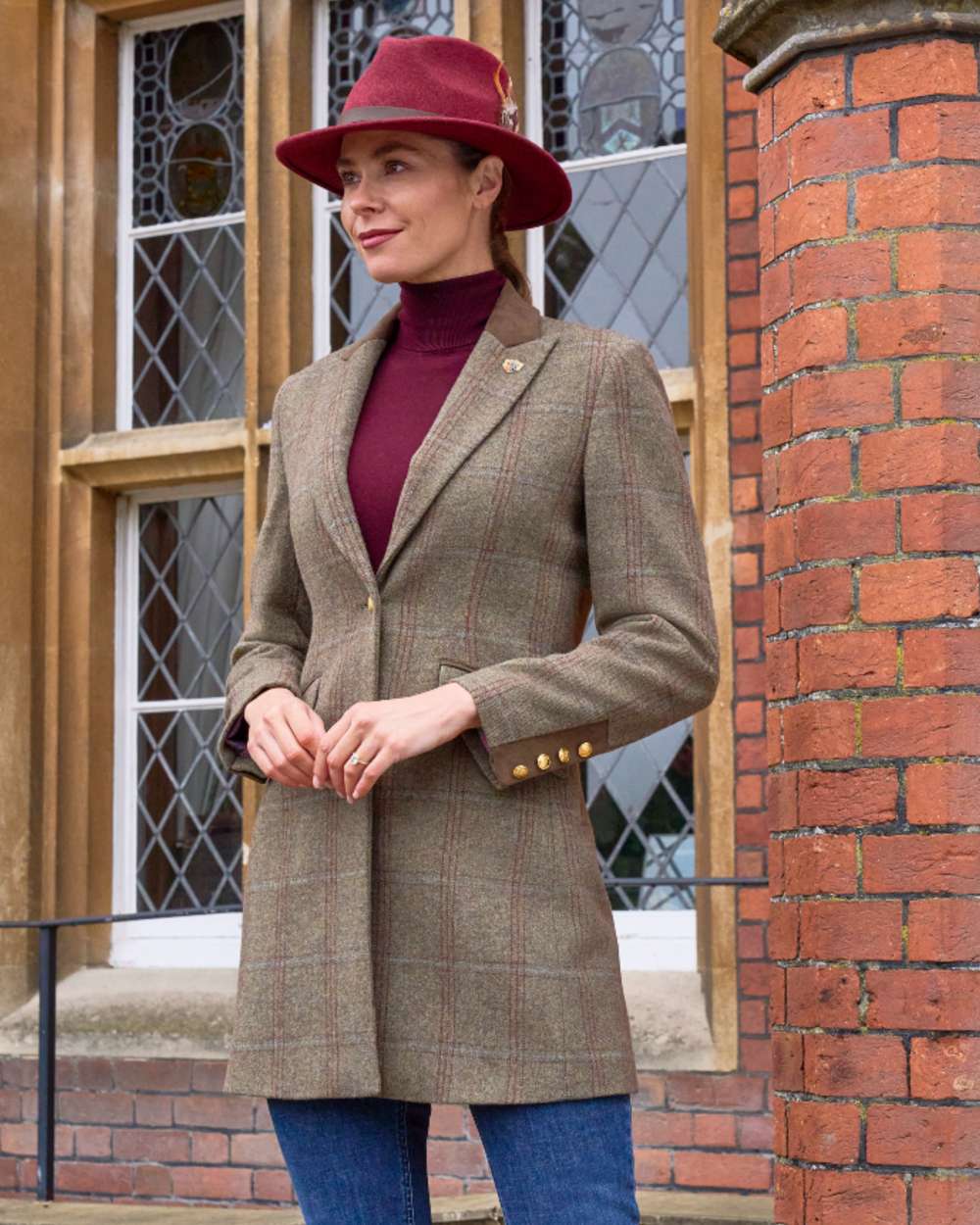 Laurel coloured Alan Paine Combrook Ladies Mid Thigh Coat on palace background 