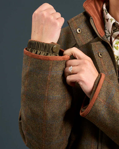 Willow coloured Alan Paine Combrook Ladies Tweed Coat on indoor background 