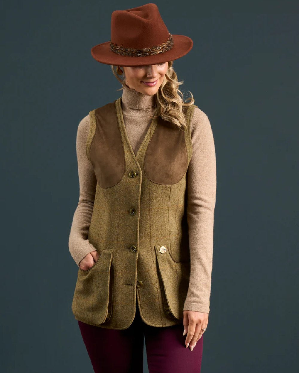 Grove coloured Alan Paine Combrook Ladies Tweed Shooting Waistcoat on indoor background 