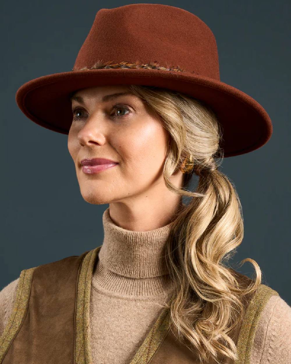 Grove coloured Alan Paine Combrook Ladies Tweed Shooting Waistcoat on indoor background 