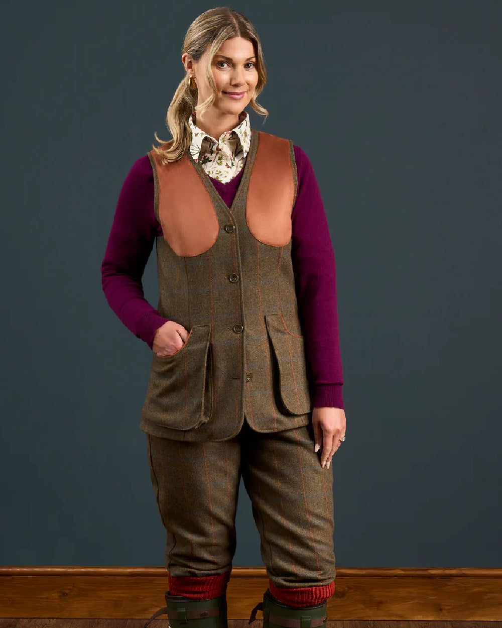 Willow coloured Alan Paine Combrook Ladies Tweed Shooting Waistcoat on indoor background 