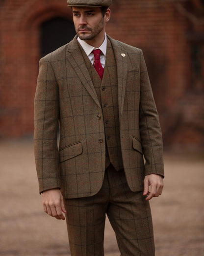 Thyme coloured Alan Paine Combrook Mens Tweed Sports Blazer on blurry background 