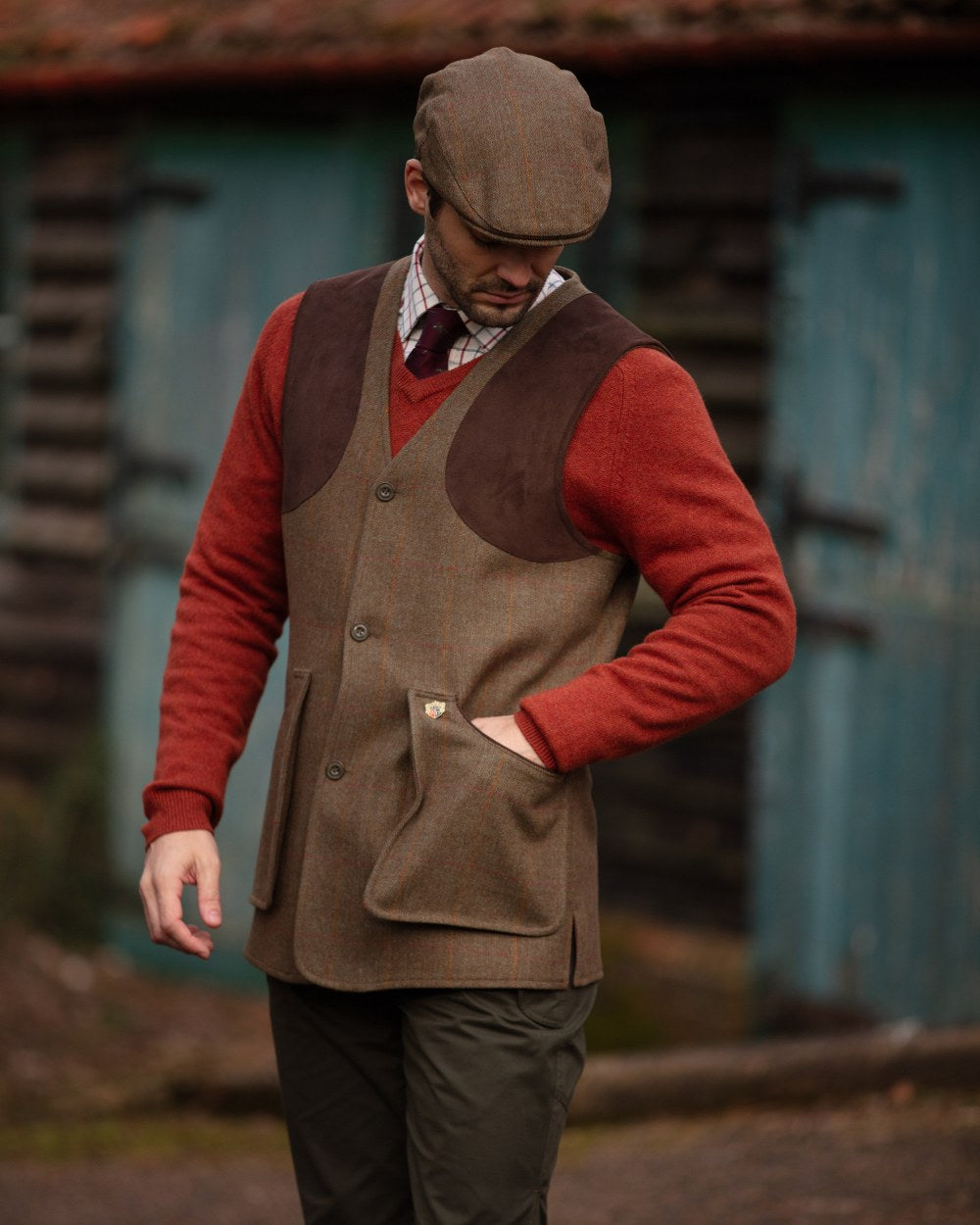 Hawthorn coloured Alan Paine Combrook Tweed Shooting Waistcoat on blurry background 