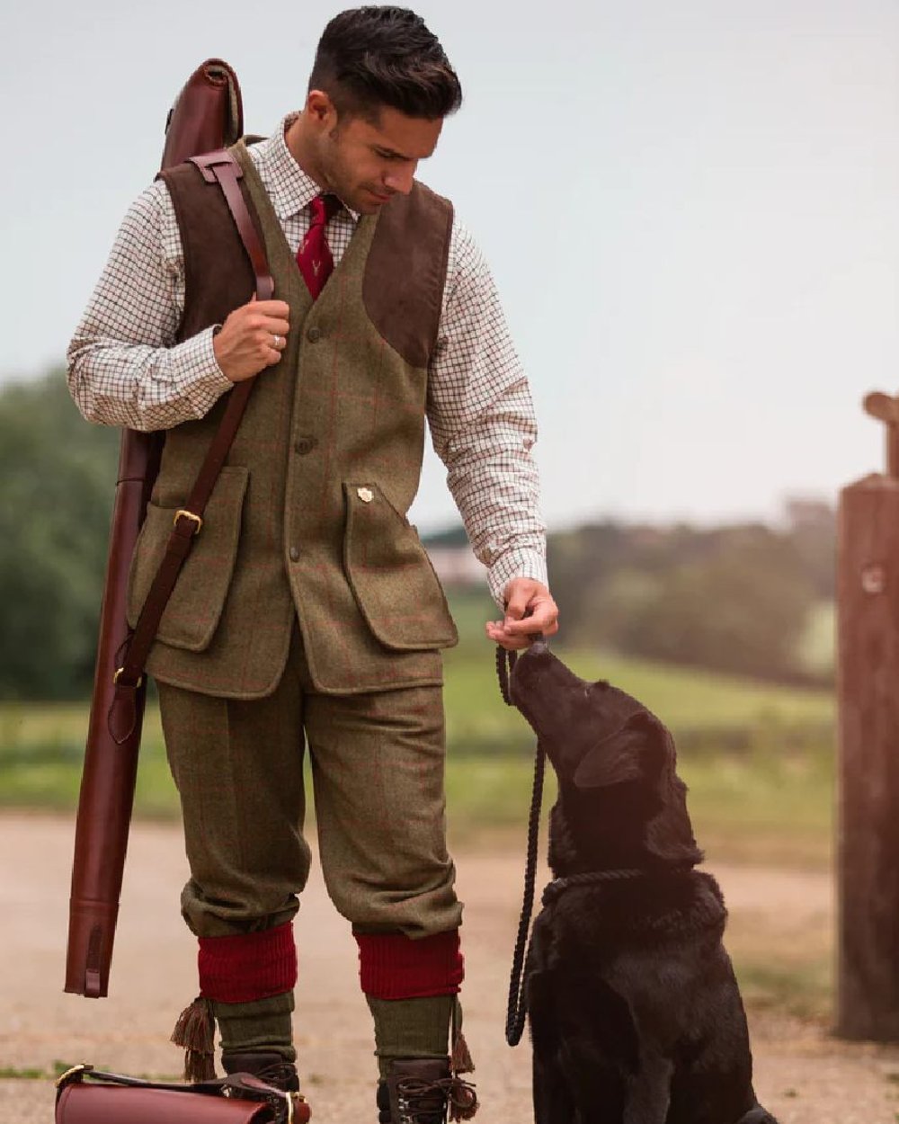 Sage coloured Alan Paine Combrook Tweed Shooting Waistcoat on street background 