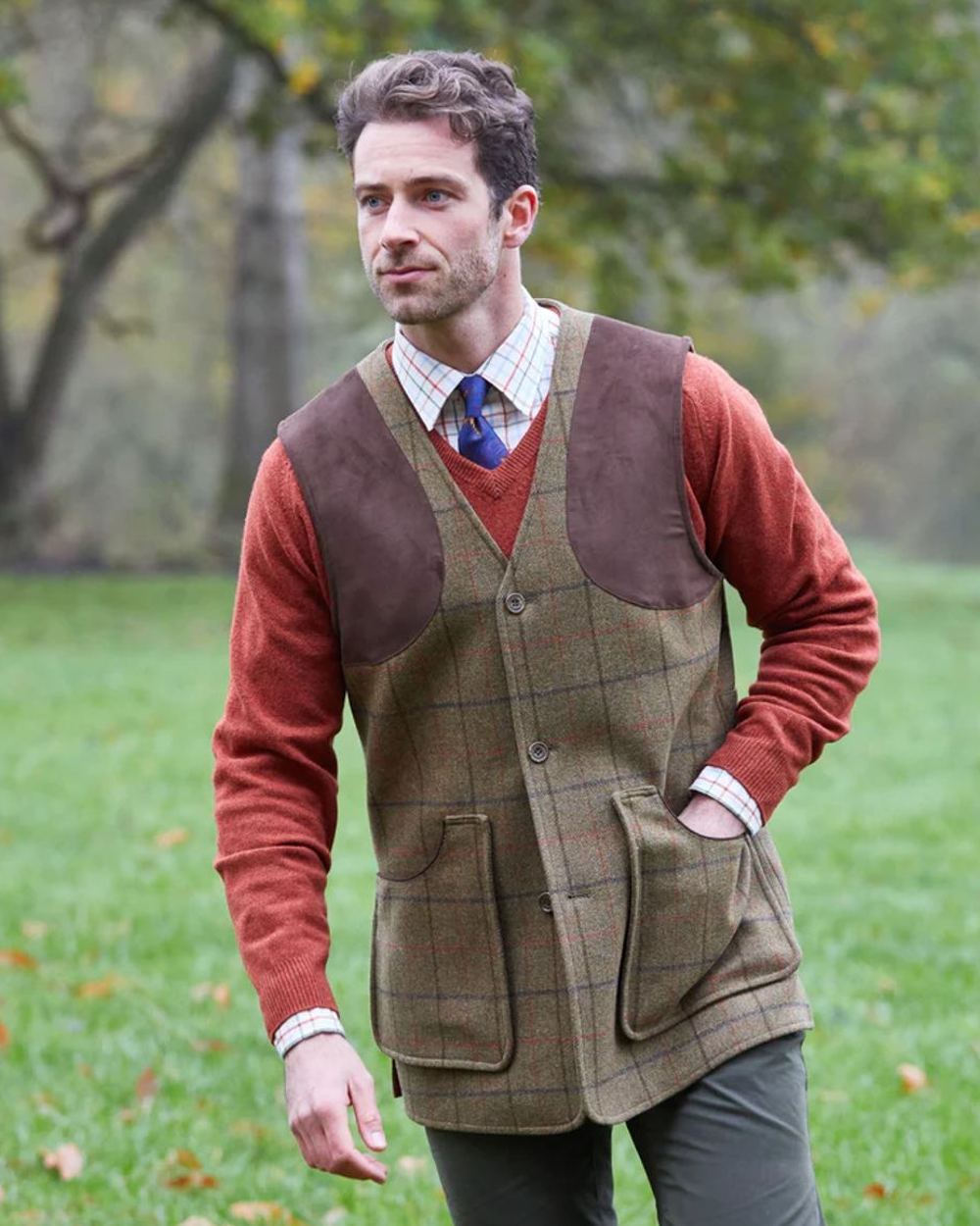 Thyme coloured Alan Paine Combrook Tweed Shooting Waistcoat on yard background 