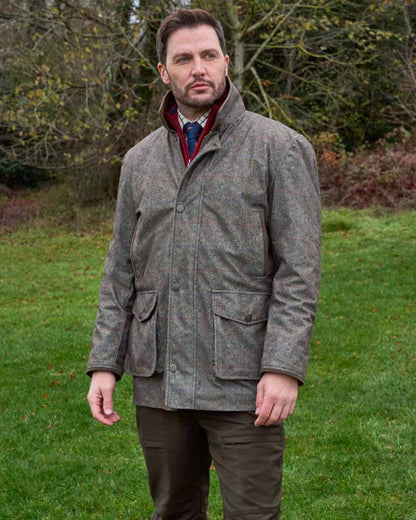 Ackley coloured Alan Paine Didsmere Mens Technical Tweed Coat on forest background 
