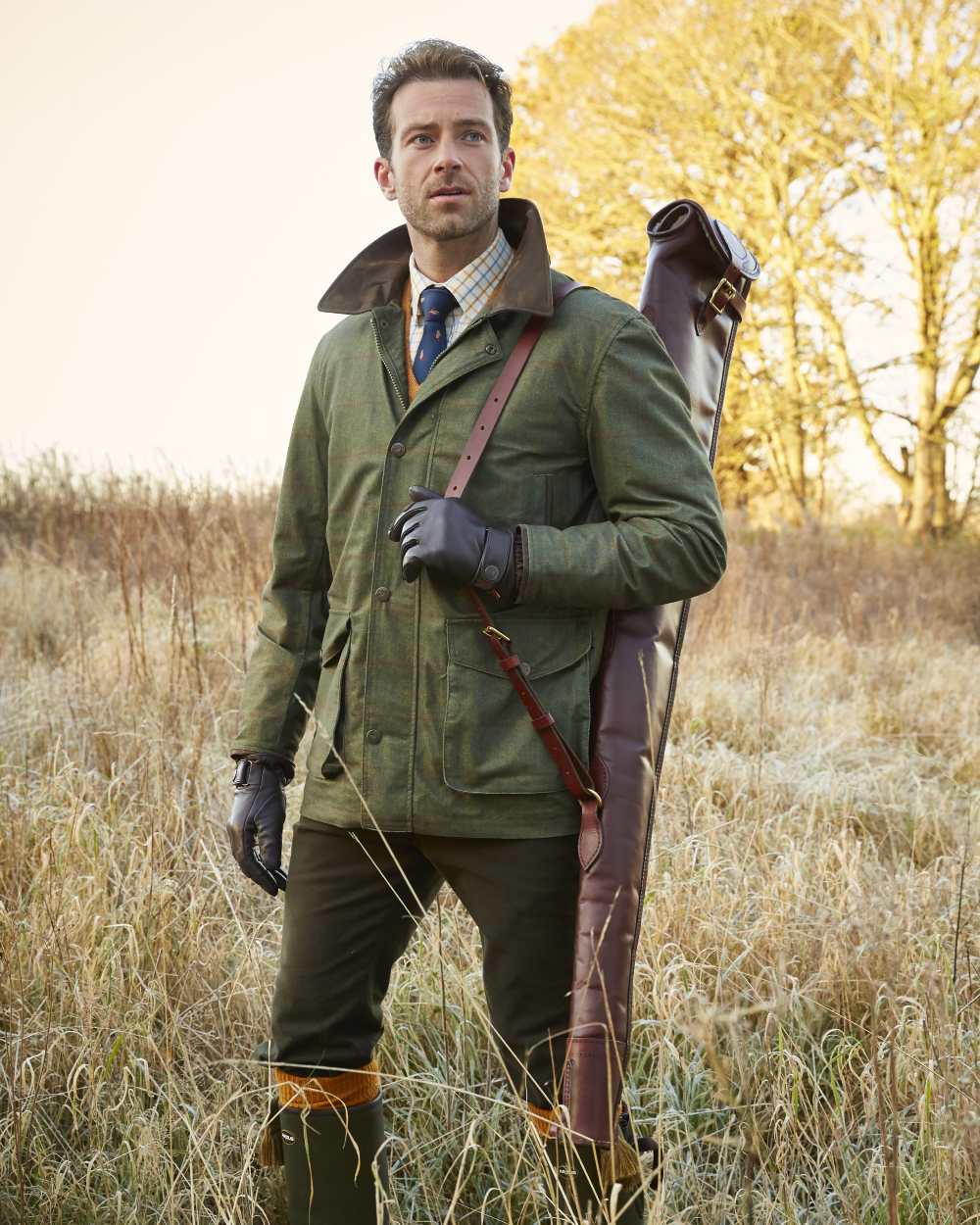 Olive coloured Alan Paine Didsmere Mens Technical Tweed Coat on forest background 