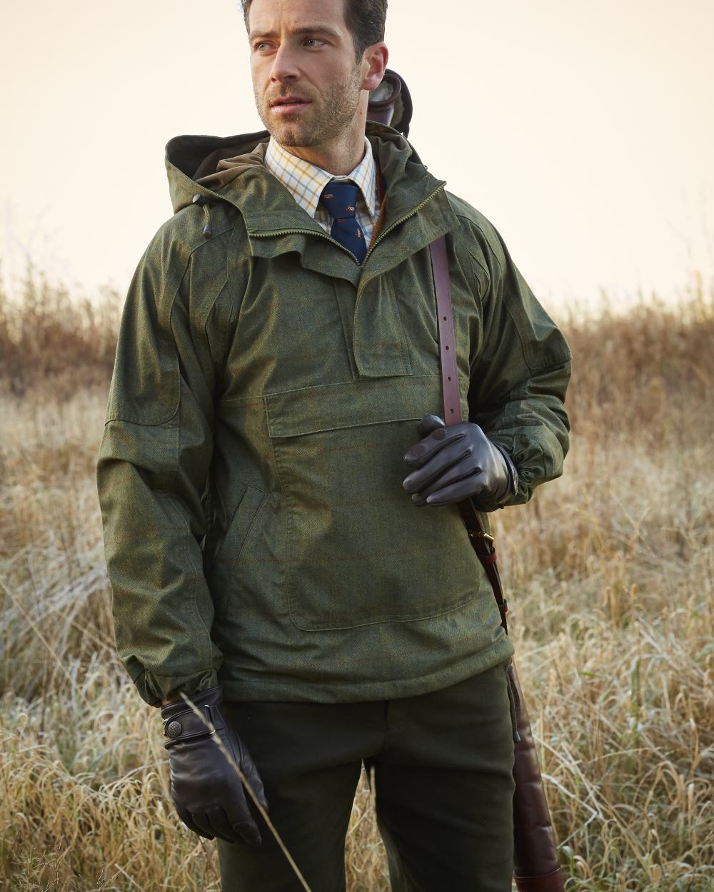 Olive coloured Alan Paine Didsmere Mens Technical Tweed Shooting Smock on blurry background 