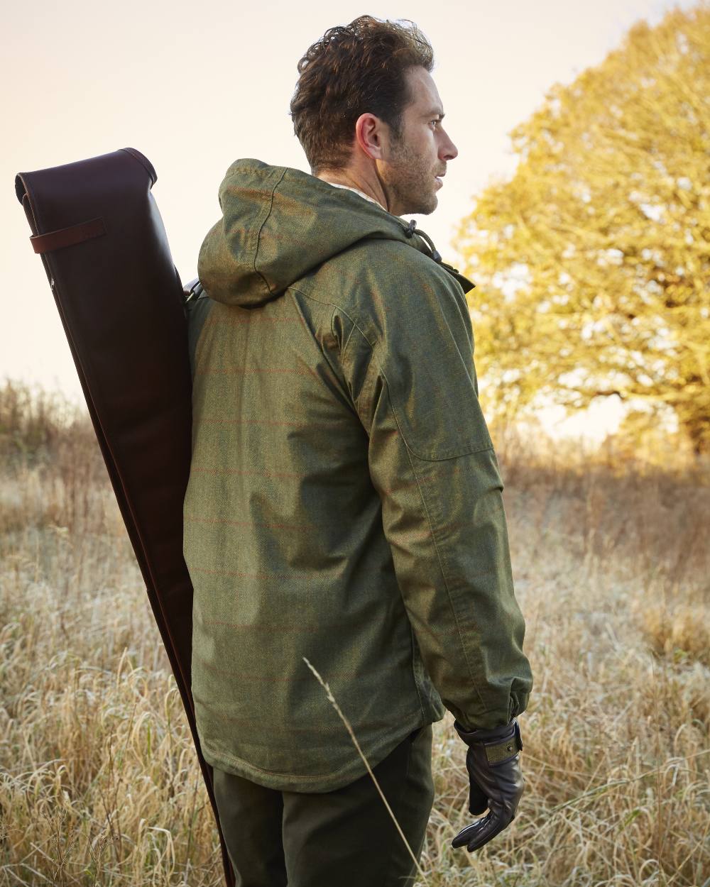 Olive coloured Alan Paine Didsmere Mens Technical Tweed Shooting Smock on blurry background 