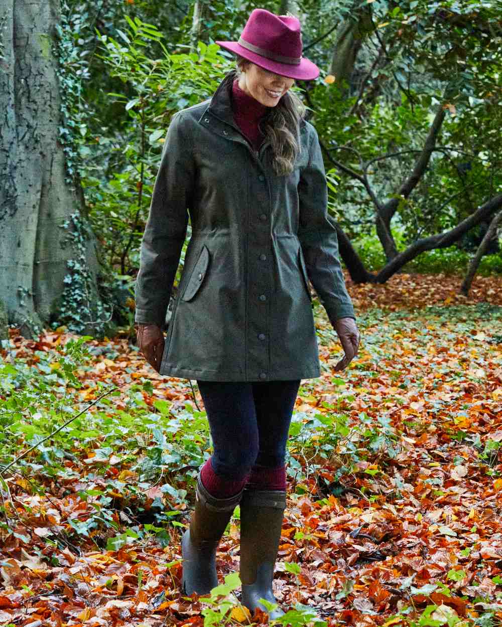 Olive coloured Alan Paine Dunswell Ladies Jacket on forest background 