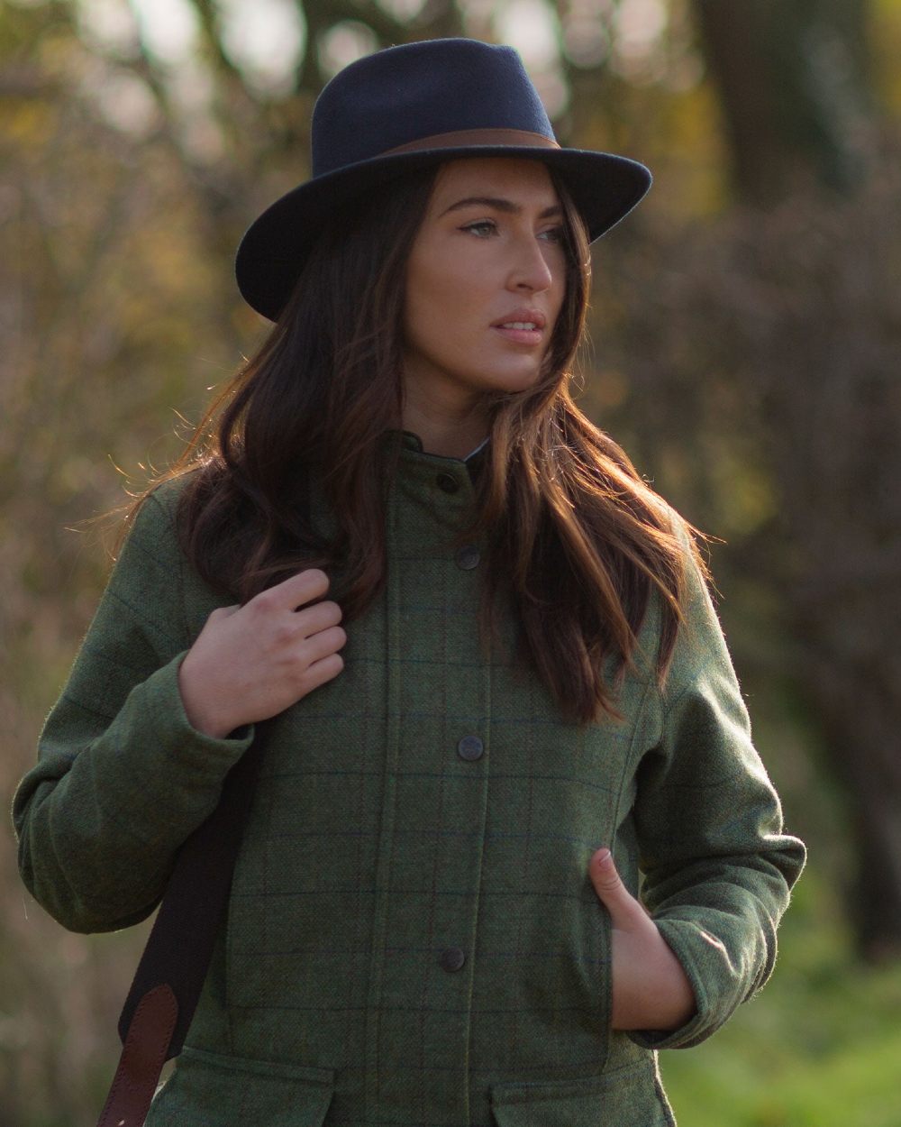 Navy coloured Alan Paine Ladies Richmond Felt Hat on blurry background 