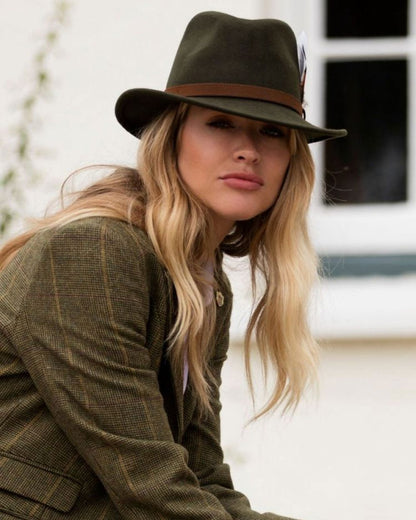 Olive coloured Alan Paine Ladies Richmond Felt Hat on blurry background 