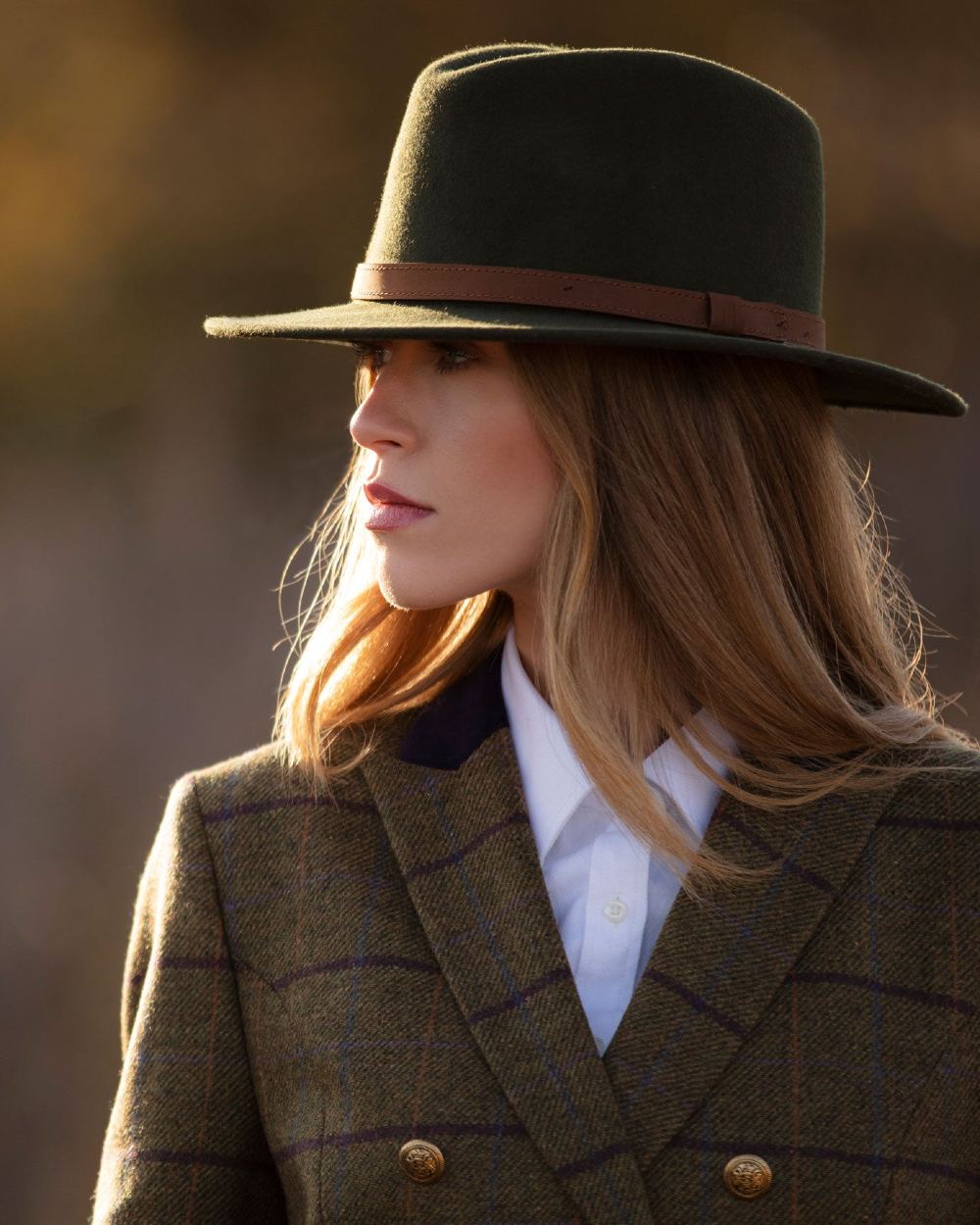 Olive coloured Alan Paine Ladies Richmond Felt Hat on blurry background 