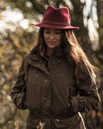 Wine coloured Alan Paine Ladies Richmond Felt Hat on blurry background 