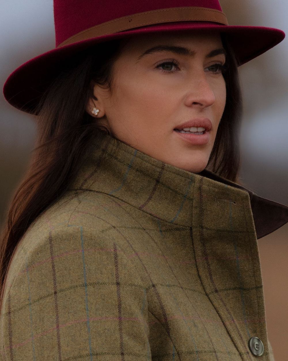 Wine coloured Alan Paine Ladies Richmond Felt Hat on blurry background 