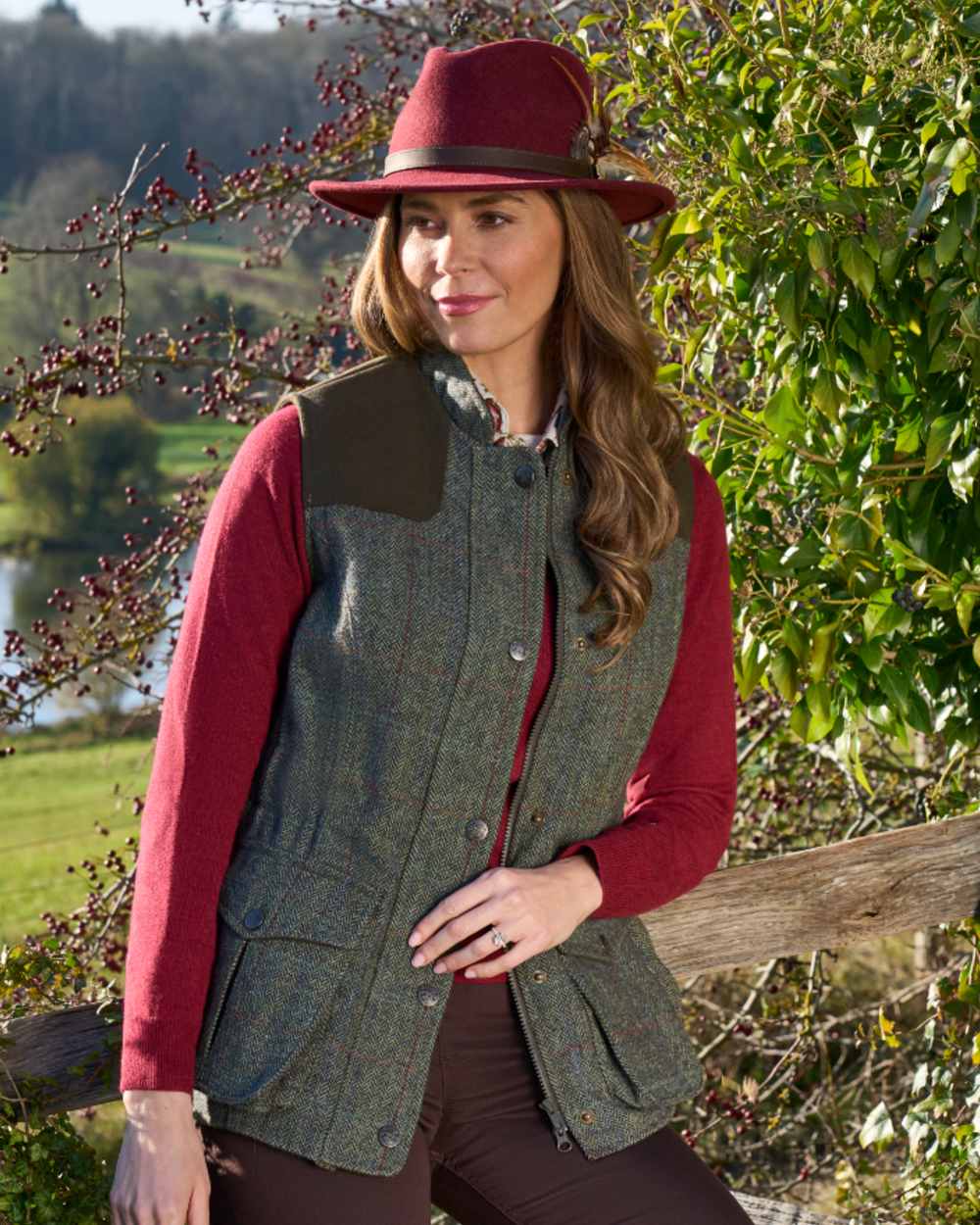 Juniper coloured Alan Paine Ladies Rutland Tweed Gilet on forest background 