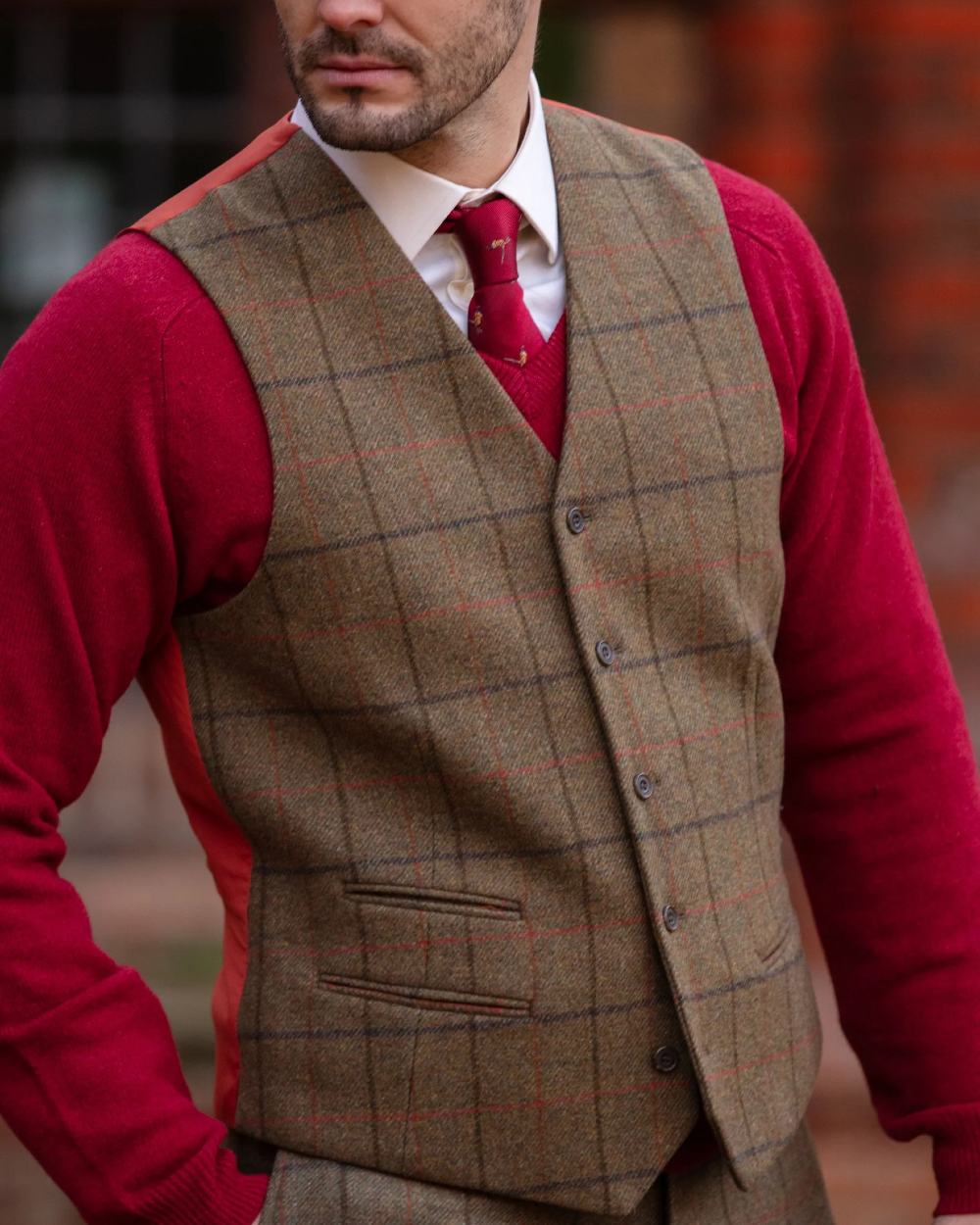 Thyme coloured Alan Paine Mens Combrook Tweed Lined Back Waistcoat on blurry background 