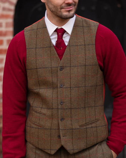 Thyme coloured Alan Paine Mens Combrook Tweed Lined Back Waistcoat on blurry background 