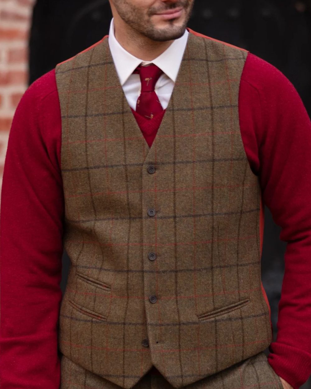 Thyme coloured Alan Paine Mens Combrook Tweed Lined Back Waistcoat on blurry background 