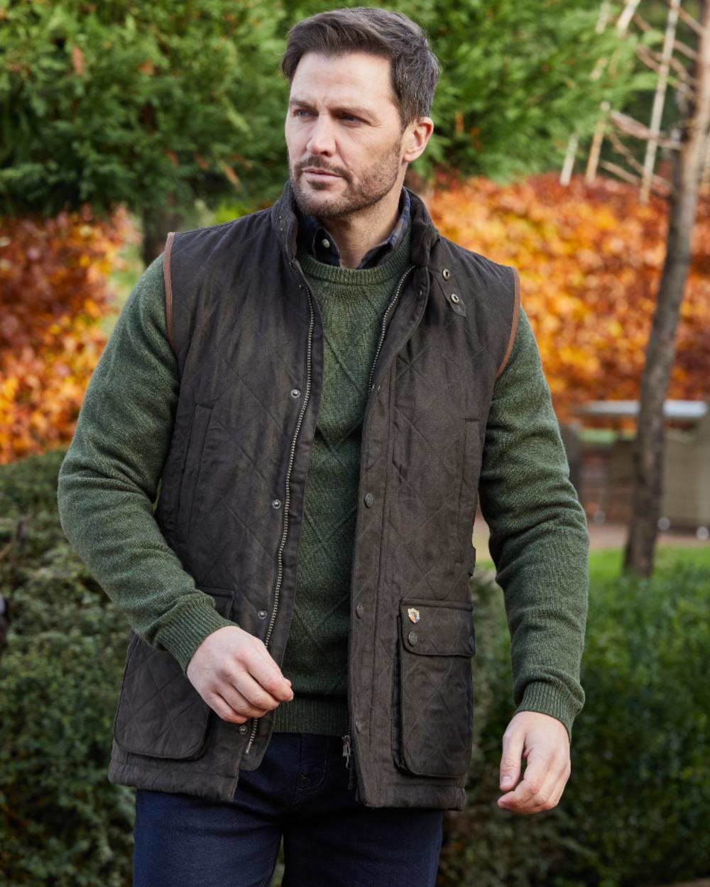 Olive coloured Alan Paine Mens Felwell Waistcoat on garden background 