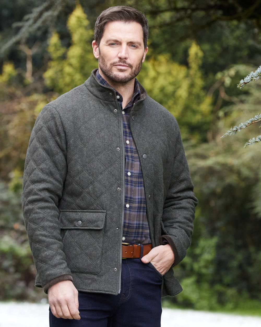 Olive coloured Alan Paine Mens Richmond Quilted Jacket on tree background 