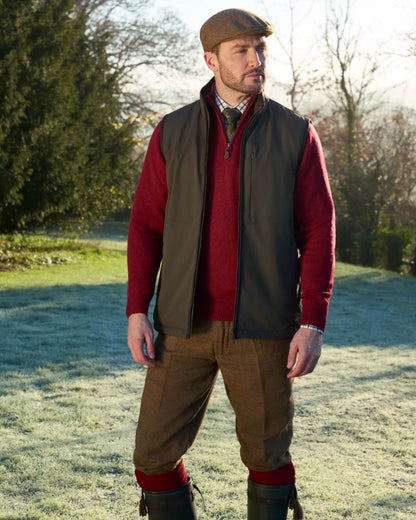 Olive coloured Alan Paine Mens Willsden Water Repellent Gilet on forest background 