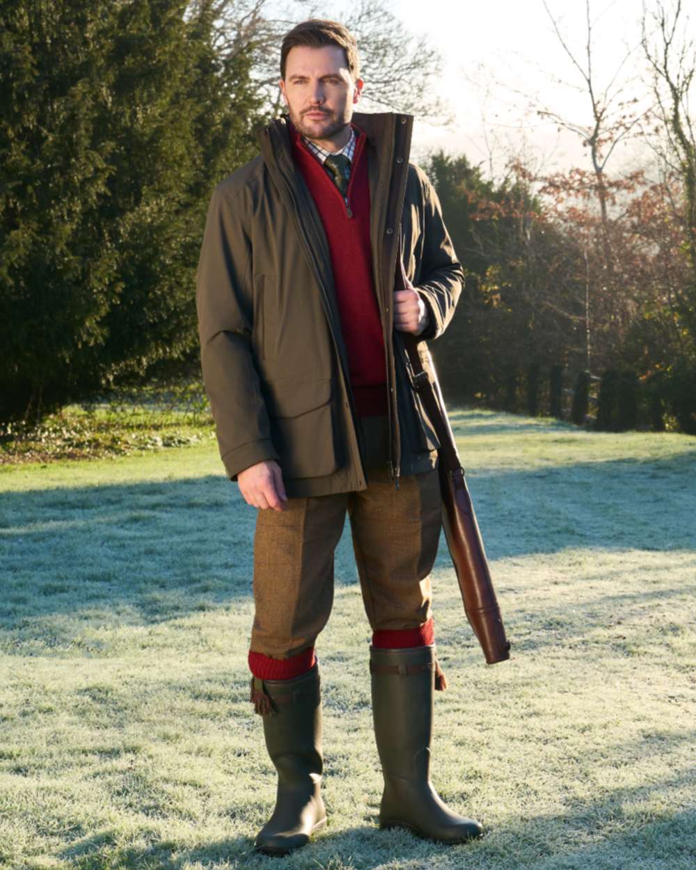 Olive coloured Alan Paine Mens Willsden Waterproof Coat on forest background 
