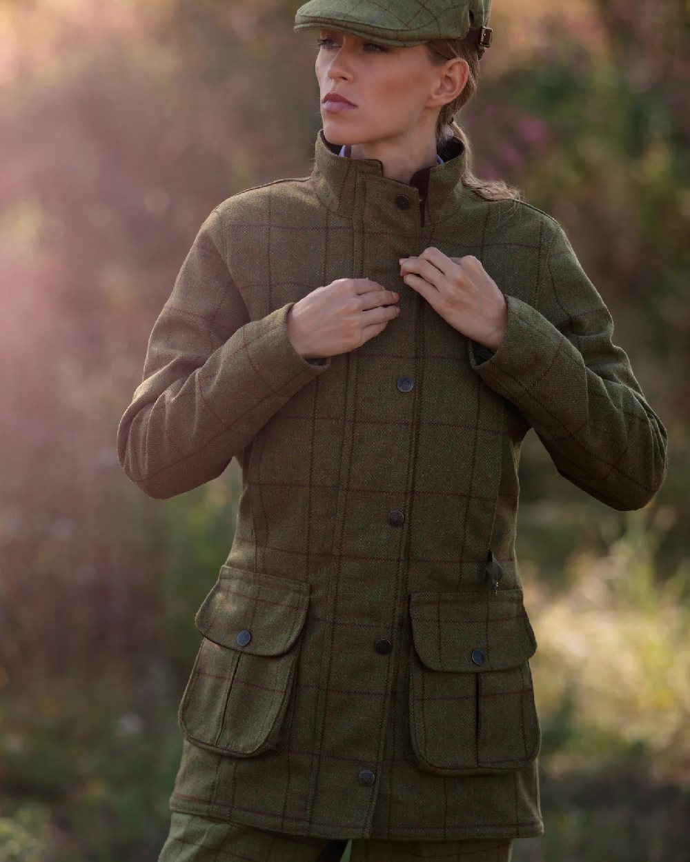 Lichen coloured Alan Paine Rutland Ladies Waterproof Tweed Jacket on blurry background 