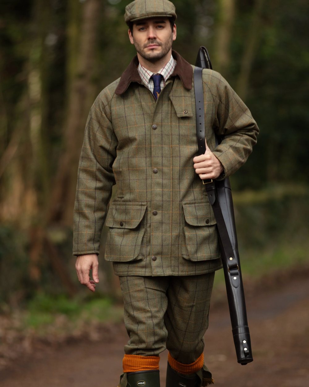 Dark Moss coloured Alan Paine Rutland Tweed Breeks on blurry background 