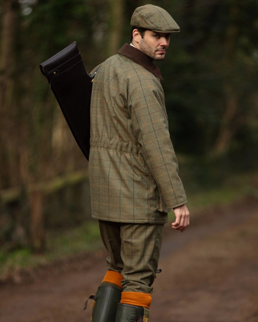 Dark Moss coloured Alan Paine Rutland Tweed Breeks on blurry background 