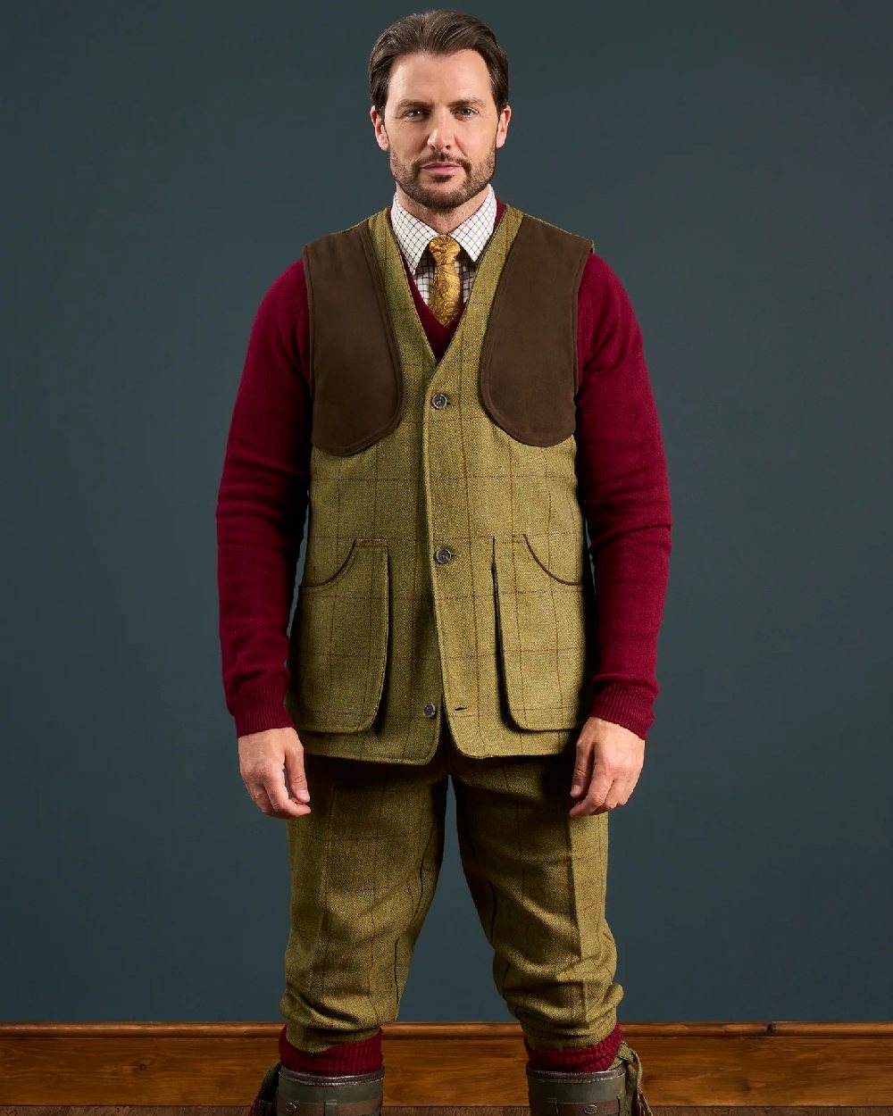 Lichen coloured Alan Paine Rutland Tweed Shooting Waistcoat on indoor background 