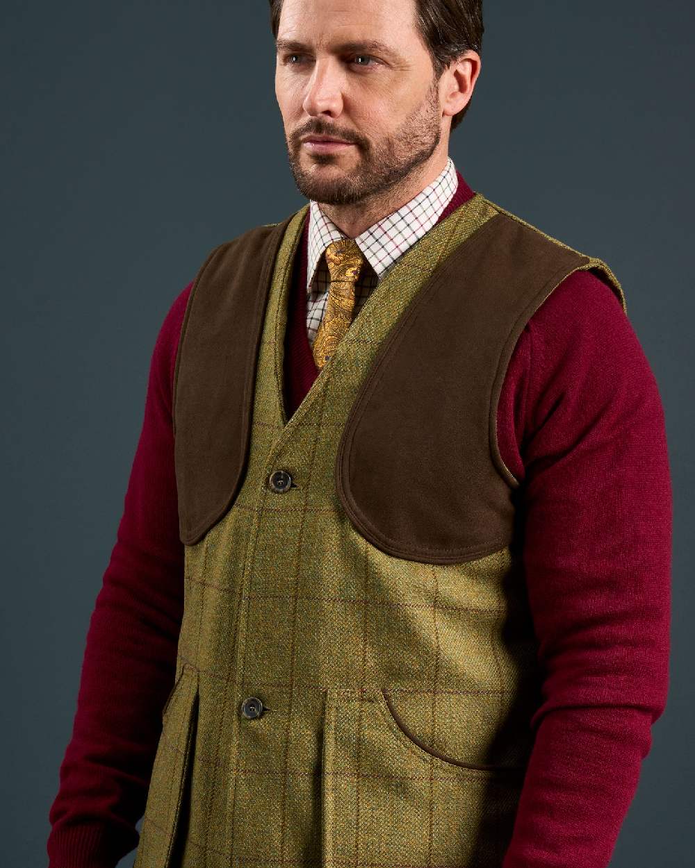 Lichen coloured Alan Paine Rutland Tweed Shooting Waistcoat on indoor background 